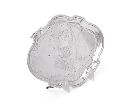 
	
		A GEORGE III SILVER SHAPED OVAL TEAPOT STAND
		BENJAMIN MOUNTIGUE, LONDON 1787
		With a raised moulded border, engraved 