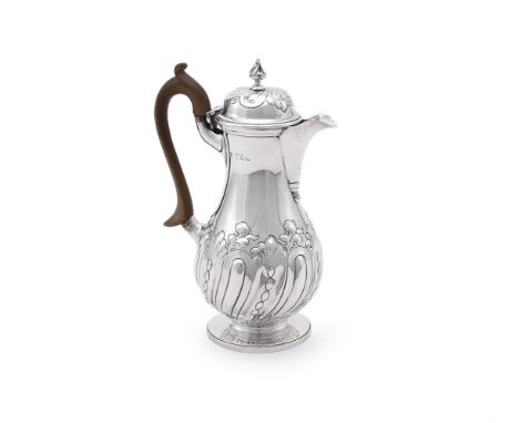 
	
		A LATE VICTORIAN SILVER BALUSTER HOT WATER POT
		CHARLES STUART HARRIS, LONDON 1898
		With a baluster foliate finial to 