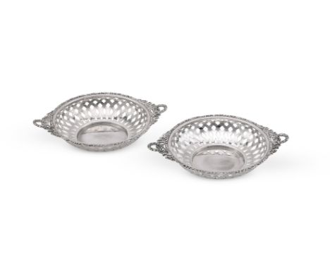 
	
		A PAIR OF EDWARDIAN SILVER PIERCED BASKETS
		ALEXANDER CLARK MANUFACTURING CO, BIRMINGHAM 1906
		With wreath and ribbon 