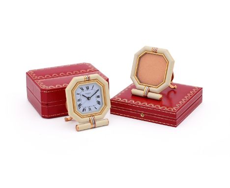 
	
		CARTIER, REF. 7517 
		A GILT METAL AND CREAM ENAMEL DESK ALARM CLOCK
		Movement: Quartz alarm
		Case: Gilt metal and cre