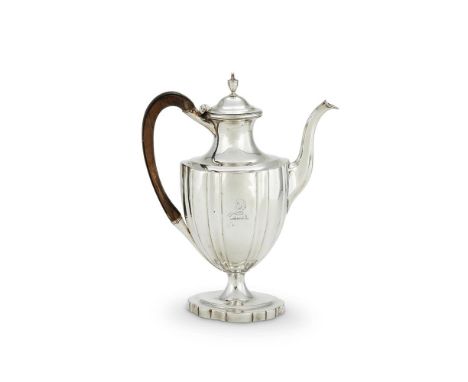 
	
		A GEORGE III SILVER OVAL PEDESTAL COFFEE POT
		ROBERT &amp; DAVID HENNELL II, LONDON 1795
		With an urn shaped finial to