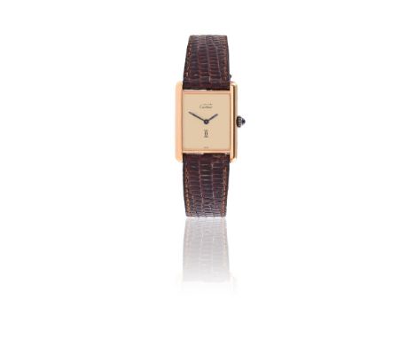 
	
		MUST DE CARTIER
		A SILVER GILT WRIST WATCH, NO. 6 027141
		Movement: Manual wind movement
		Case: Silver gilt case, scr