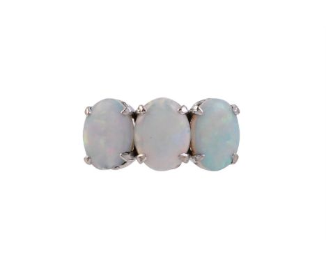 
	
		A THREE STONE OPAL RING
		The trio of oval cabochon opals within four claw settings, to pierced bar gallery, the shank s