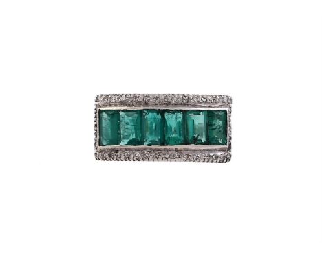 
	
		AN EMERALD AND DIAMOND PANEL RING
		The ring centred with a row of step cut emeralds in a channel setting, within a surr