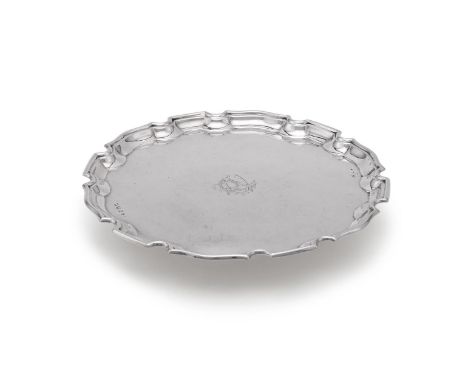 
	
		A SILVER SHAPED CIRCULAR SALVER
		CHARLES S. GREEN &amp; CO. LTD., BIRMINGHAM 1929
		With a raised moulded border and en