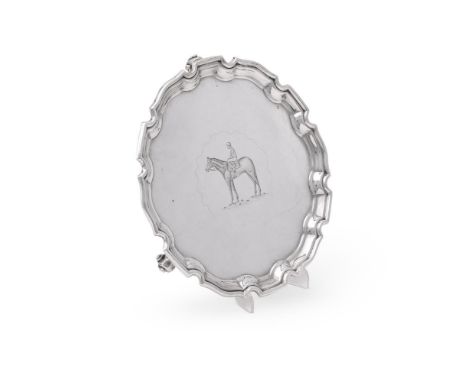 
	
		A SILVER SHAPED CIRCULAR SALVER
		WAKELY &amp; WHEELS, LONDON 1980
		With a raised and moulded border, engraved with a j