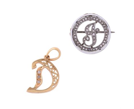 
	
		A GEORGE V DIAMOND AND ENAMEL INITIAL BROOCH 
		CIRCA 1917
		The scrolled J set with rose cut diamonds within a rose cut