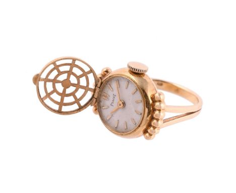 
	
		PIAGET, A GOLD COLOURED RING WATCH
		CIRCA 1980
		The ring with a signed circular dial with baton hour markers, beneath 