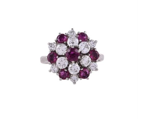 
	
		A RUBY AND DIAMOND CLUSTER RING
		The circular cut ruby within a surround of brilliant cut diamonds, to an alternating r