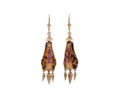 
	
		A PAIR OF VICTORIAN AND LATER GARNET EAR PENDANTS
		The gold scrolling drops set with oval cut garnets with a trio of pe