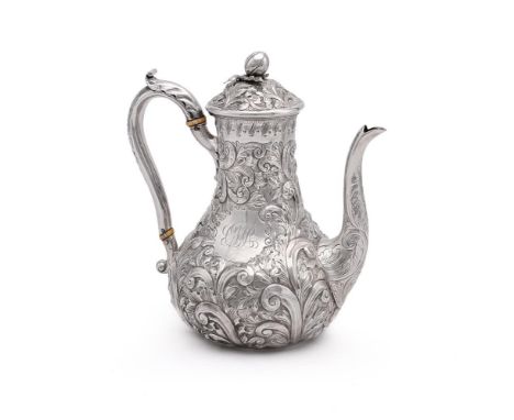 
	
		A VICTORIAN SILVER BALUSTER COFFEE POT
		ALEXANDER MACRAE, LONDON 1863
		With a bud finial to the foliate chased domed c