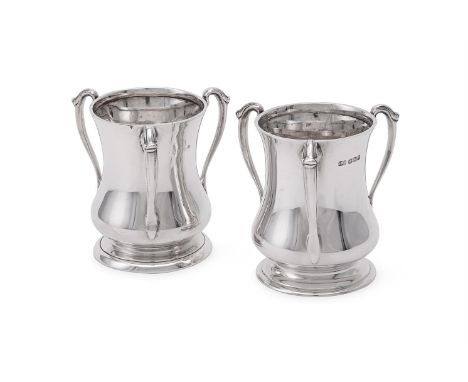
	
		A MATCHED PAIR OF SILVER ART NOUVEAU THREE HANDLED VASES
		ATKIN BROTHERS, SHEFFIELD 1927, MAKER'S MARK OBSCURED, BIRMIN