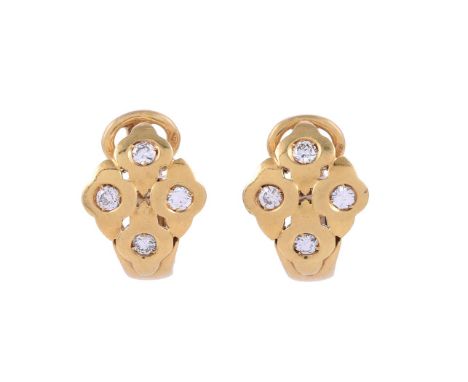 
	
		A PAIR OF DIAMOND EAR CLIPS 
		LONDON 1979 IMPORT MARK
		The pierced quatrefoil panels each rub over set with a brillian