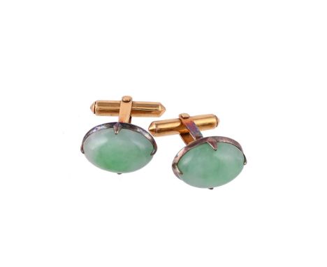 
	
		A PAIR OF JADEITE JADE CUFFLINKS
		The oval cabochon jadeite jade panels in four claw settings, to swivel terminals
		Si