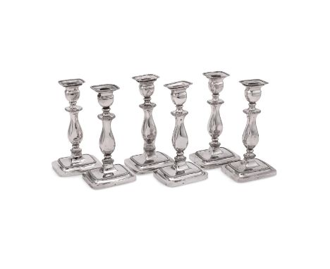 
	
		A MATCHED SET OF SIX DUTCH SILVER CANDLESTICKS
		.935 STANDARD, CIRCA 1826 (4) AND 1847 (2)
		With gadrooned oblong scon