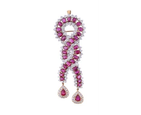
	
		A RUBY AND DIAMOND WOVEN DROP PENDANT/BROOCH
		The crossover slightly articulated panel set with oval cut rubies between