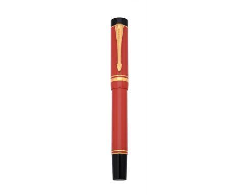 
	
		PARKER, DUOFOLD CENTENNIAL
		AN ORANGE FOUNTAIN PEN
		Cap and Barrel: Orange cap and barrel, the cap with gilt arrow cli