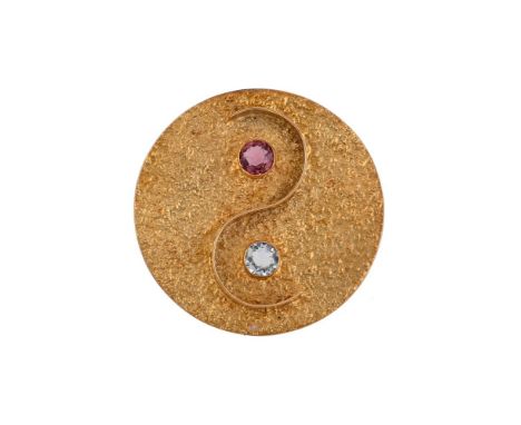 
	
		AN ABSTRACT YIN-YANG BROOCH/PENDANT
		The textured circular panel with a curving crossover band and circular cut tourmal