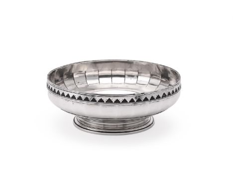 
	
		A SILVER PEDESTAL FRUIT BOWL
		WILLIAM COMYNS, LONDON 1912
		With a dart band and on a circular moulded spreading pedest