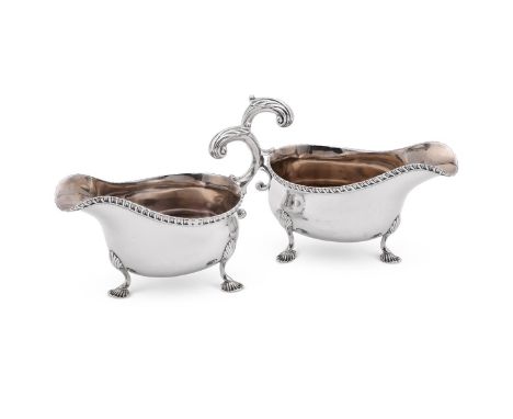 
	
		A PAIR OF EDWARDIAN SILVER OVAL SAUCE BOATS
		D. &amp; J. WELLBY LTD., LONDON 1908
		With gadrooned border, leaf capped 