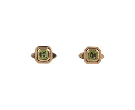 
	
		TIFFANY &amp; CO., A PAIR OF PERIDOT CUFFLINKS
		The squared polished gold coloured panels with step cut peridots with c
