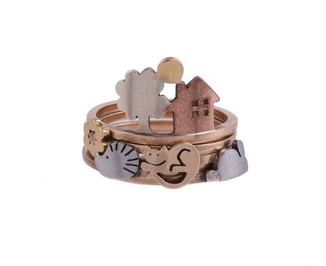 
	
		A NOVELTY INTERLOCKING DRESS RING
		The five polished bands each with an applied motif, comprising a cat, rabbit, hedgeh