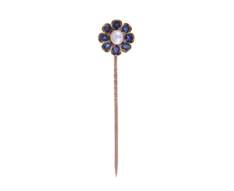
	
		AN ANTIQUE AND LATER SAPPHIRE, PEARL AND DIAMOND FLOWER HEAD STICK PIN
		The petals set with cushion cut sapphires, with
