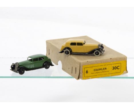 Dinky Toys 30c Daimler, two examples, first pale tan body, black open chassis, smooth hubs, white tyres, second green body, b