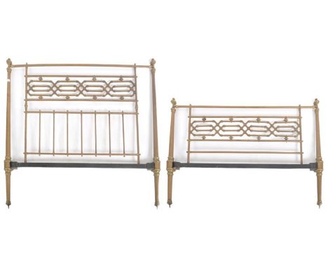 A 19th Century Victorian double sized brass bed. Headboard and footboard present with cylindrical sides and central architect