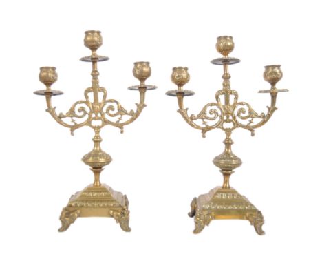 A pair of 19th Century gilt brass candelabra centrepiece garnitures. Each with triple candlestick sconces set with scrollwork
