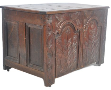 A large 18th Century carved oak coffer blanket box storage chest trunk. Intricate carved floral panels and geometric decorati