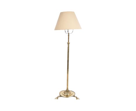An early 20th Century Art Nouveau brass telescopic standard lamp light. Cylindrical form with adjustable column raised over s