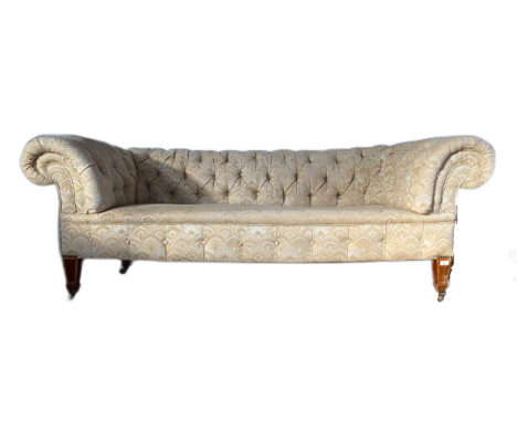 A late 19th Century Victorian two seater sofa settee having Chesterfield style scrolled button backed backrests and armrest w