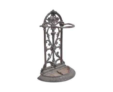 A 19th Century Victorian cast iron stick stand in the manner of Coalbrookdale . Architectural form with scrollwork raised on 