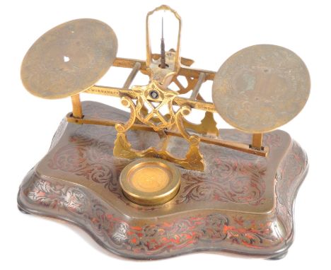 A 19th Century Boulle Work set of postal scales by S Mordan &amp; Co of London. Foliate engraved oval trays raised on decorat