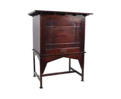 Manner of&nbsp;E A Taylors for Wylie and Lochhead - A 20th Century Mahogany Arts &amp; Crafts cabinet on stand. Flared top wi