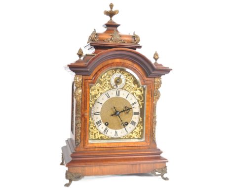 A late 19th Century walnut and mahogany bracket clock. 8 day sprung movement striking on two coiled gongs With cast gilded fi