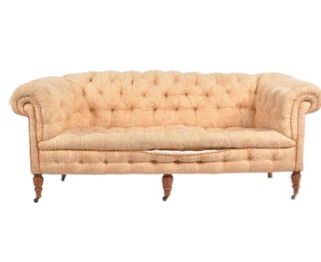 A 19th Century Victorian two seater sofa settee having Chesterfield style scrolled button backed backrests and armrest with a