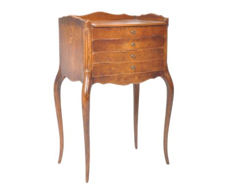 A 19th Century French walnut commode chest / nightstand having a carved&nbsp;gallery back and sides above a bank of four draw