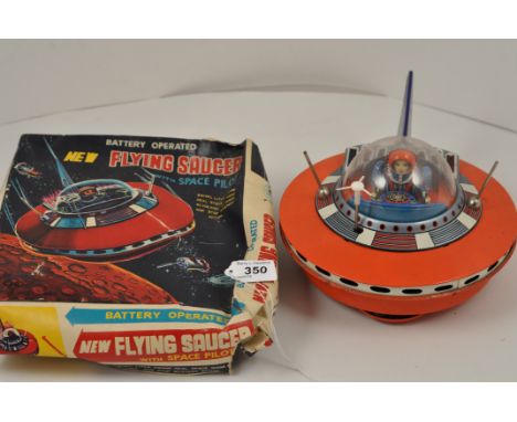 VINTAGE MADE IN JAPAN TIN PLATE BATTERY OPERATED FLYING SAUCER WITH SPACE PILOT WITH ORIGINAL BOX