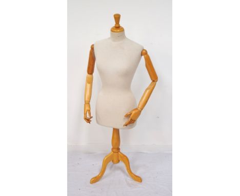 FEMALE DRESS MAKER'S DUMMYwith fully articulated arms, hands and fingers, on pedestal and tripod stand, 136cm high