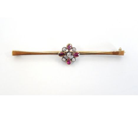 DIAMOND AND RUBY CLUSTER SET BAR BROOCHin nine carat gold, 5.7cm long