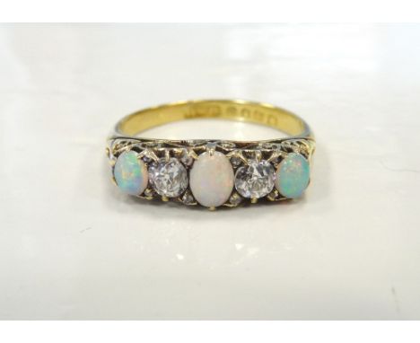 LATE VICTORIAN OPAL AND DIAMOND RING the diamonds totalling approximately 0.3cts, on eighteen carat gold shank, ring size O