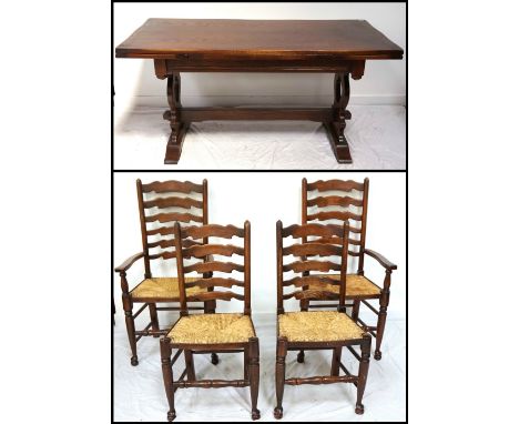 OAK DRAW-LEAF DINING TABLEwith a carved frieze, standing on shaped end supports united by a stretcher, 228cm extended, togeth