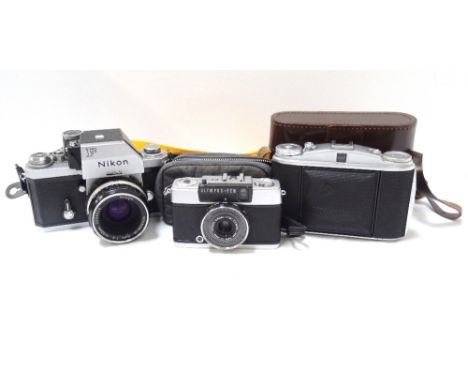 OLYMPUS-PEN EE-2 35MM CAMERAwith a wrist carry strap and soft case, a Nikon 35mm camera and an Agfa Isolette folding camera i