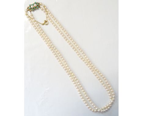 ATTRACTIVE DOUBLE STRAND CULTURED PEARL NECKLACE
with turquoise and pearl set nine carat gold clasp, with safety chain, appro