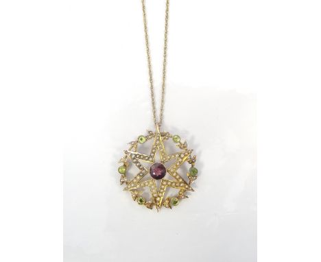 EDWARDIAN AMETHYST, PERIDOT AND SEED PEARL PENDANTthe seed pearl set star around a central amethyst, with a surrounding circl