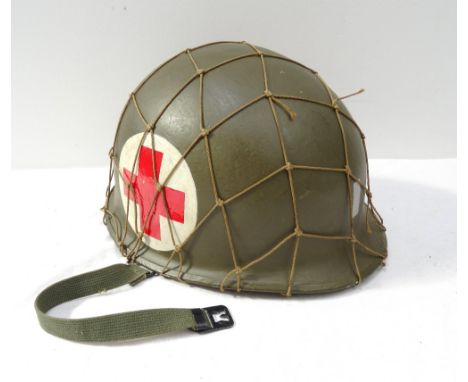 UNITED STATES ARMY MEDICAL CORPS STEEL HELMETVietnam War era, 'Steinberg Bros' marked headband liner with webbing chinstrap