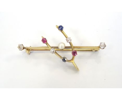 EDWARDIAN DIAMOND, RUBY, SAPPHIRE AND SEED PEARL WISH BONE BAR BROOCHin unmarked gold, the central pearl within diamond, sapp