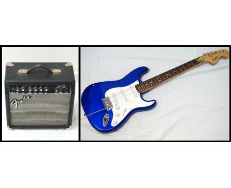 'SQUIER STRAT BY FENDER' ELECTRIC GUITARAffinity Series, with blue body and tremelo arm; and a 'Fender Frontman 15G' amplifie